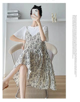 Elegant floral maternity dress in knee-length, featuring a boat neck and layered design, perfect for baby showers.