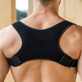 Rear view of an adjustable posture corrector back brace in black, designed for back support and alignment.