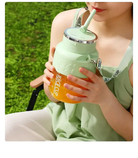 Person enjoying a refreshing drink from a Wireless Portable Juicing Bucket, showcasing its stylish design and ease of use.