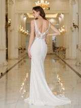 Back view of MisShow white mermaid wedding dress with lace and pearl details, floor-length design in elegant setting.