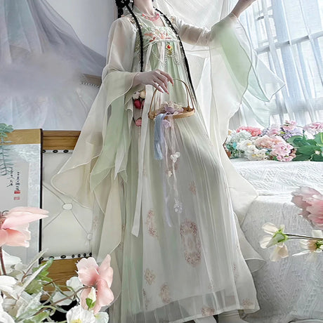 Elegant Vintage Chinese Hanfu dress with flowing sleeves, featuring floral patterns and a delicate design.