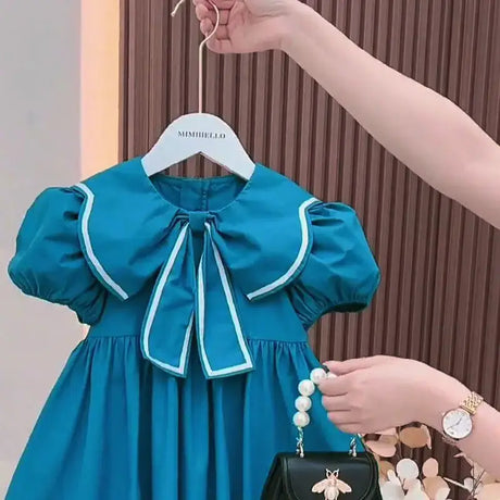 Baby girls summer dress in blue with cute puff sleeves and Peter Pan collar, perfect for ages 4-6.