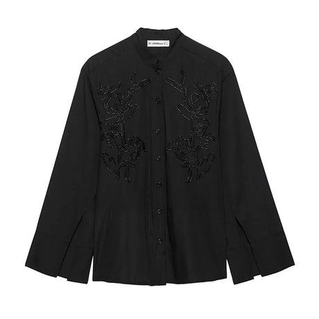Elegant black long sleeve blouse with intricate embroidery, perfect for casual and stylish outfits.