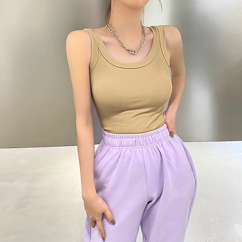RetroRib™ 90s vintage ribbed tank top in beige, paired with lavender pants, showcasing a streetwear style.