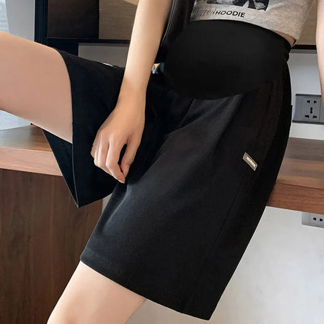 Plus size wide leg maternity pants, black summer capris for comfortable wear during pregnancy.