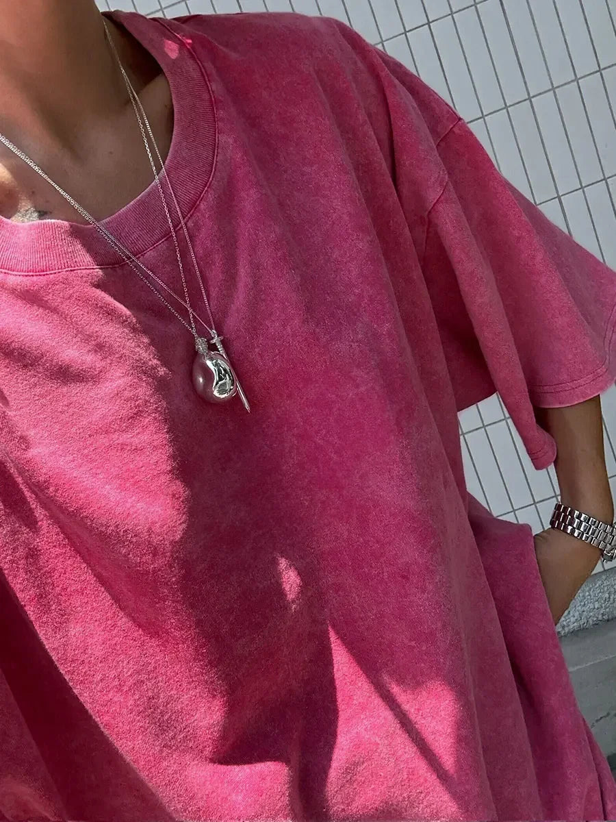 Casual women's pink wax printed t-shirt featuring a loose fit and regular length with O-neck collar.