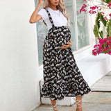 Maternity summer dress in floral print, ideal for comfortable pregnancy wear, featuring a stylish design and casual vibe.