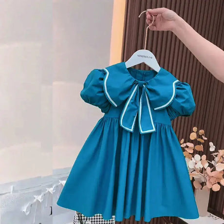 Cute summer blue dress for baby girls with puff sleeves and Peter Pan collar, perfect for ages 4-6Y.