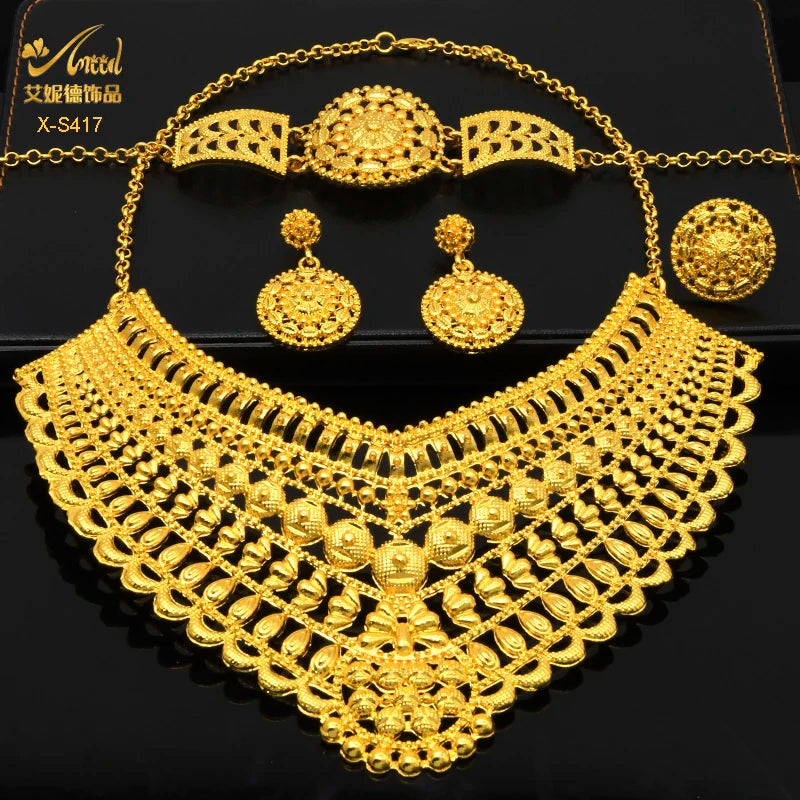 Luxury Indian bridal jewelry set featuring a 24K gold plated necklace, earrings, and bracelet for weddings.
