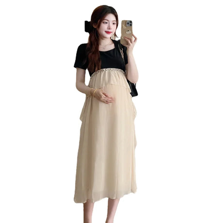 Short sleeve maternity dress in beige with black top, perfect for summer casual photoshoots. Lightweight and stylish for expecting mothers.