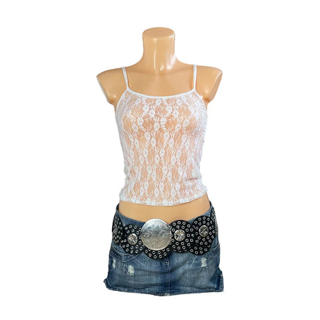 LaceMuse™ white lace spaghetti strap top on a mannequin, paired with a denim skirt and embellished belt.