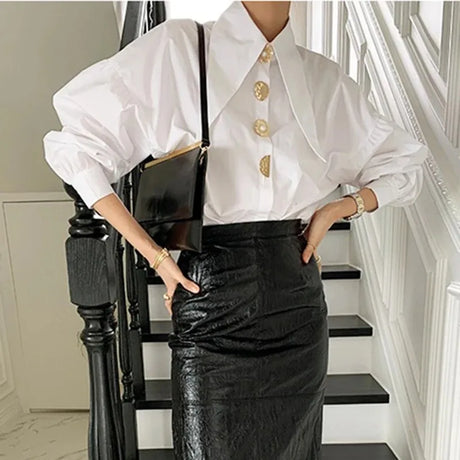 Model showcasing PearlEdge™ pearl-button shirt, styled with a black leather skirt, highlighting Y2K fashion and Korean style.