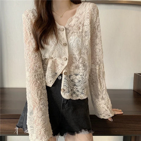 SheerCharm™ see-through lace sun shirt in cream, featuring long sleeves and decorative buttons, perfect for summer style.