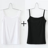 White and black solid cotton strap camisoles on hangers, essential crop tops for everyday wear.