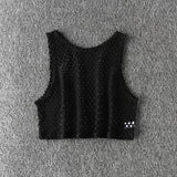 MeshGlow™ Hollow-Out Summer Crop Top in black, breathable fishnet fabric, casual loose fit, perfect for warm weather.