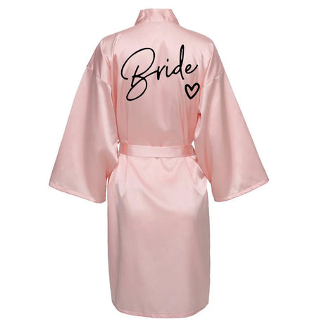 Pink satin robe with 'Bride' printed on the back, perfect for bridal parties and wedding mornings.