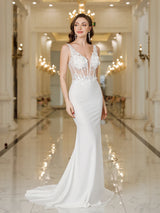 Elegant MisShow white mermaid wedding dress, featuring lace, pearls, and a stunning backless design in a luxurious venue.