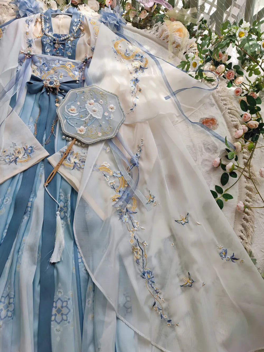 Women’s Fairy Hanfu summer costume with blue and white embroidery, traditional Chinese design and matching accessory.