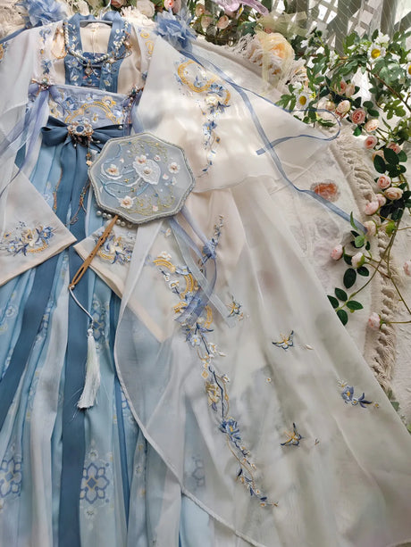 Women’s Fairy Hanfu summer costume with blue and white embroidery, traditional Chinese design and matching accessory.