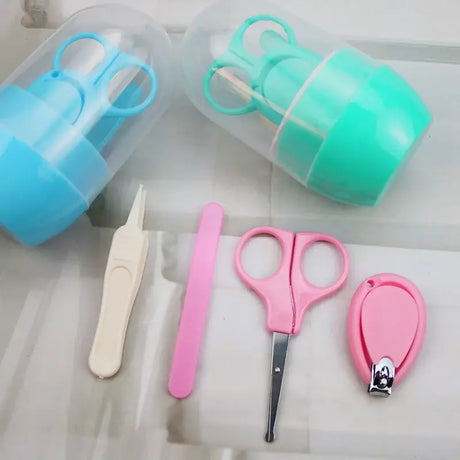 Newborn baby nail scissor set including clippers and trimmer in cartoon design, safe for ages 0-6 years.