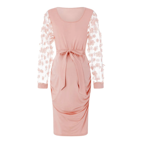 Vintage mesh floral maternity gown in blush pink with long lace sleeves and a flattering silhouette for photo shoots.