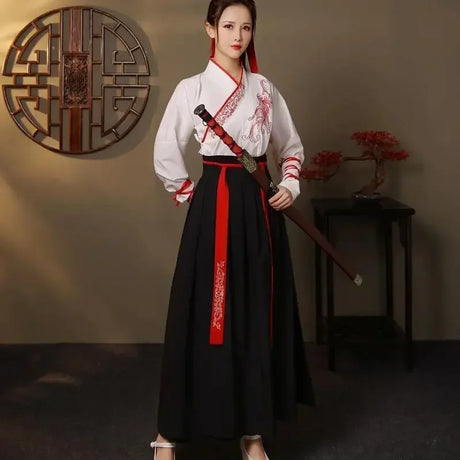 Model wearing a Streetwear Casual Chinese Hanfu Dress with red accents and traditional styling, set in an elegant interior.