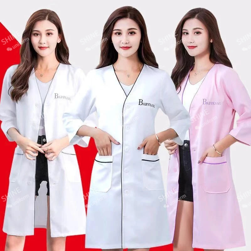 Custom logo spa beauty uniforms in white and pink for women, featuring v-neck design and pockets.