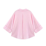 Back view of AsymLinen™ wide sleeve linen shirt in pink, featuring a turn-down collar and loose fit.