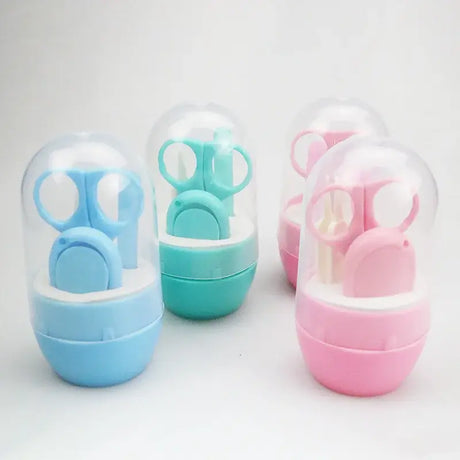Newborn baby nail scissor set in pink and blue packaging, safe for infants and toddlers with cartoon designs.