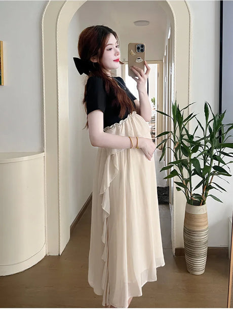 Maternity photoshoot dress featuring short sleeves, flowing skirt, and solid colors, perfect for summer casual wear.