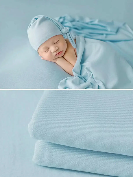 Newborn soft wrap blanket in light blue, perfect for photography and gentle comfort for babies.
