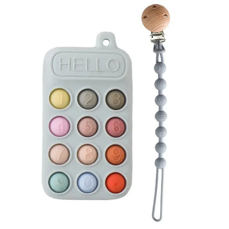 Silicone baby teether shaped like a phone with numbers and a pacifier clip, designed for teething relief.