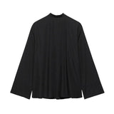 Back view of EmbroiChic™ elegant black embroidery shirt for women, featuring long sleeves and a modern Korean style.