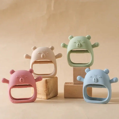 Colorful silicone baby teether gloves in bear design, suitable for children ages 0-6 years.