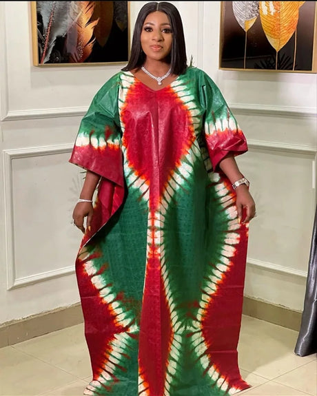 African plus size long maxi dress in vibrant red and green print, featuring short sleeves and traditional Kanga style.