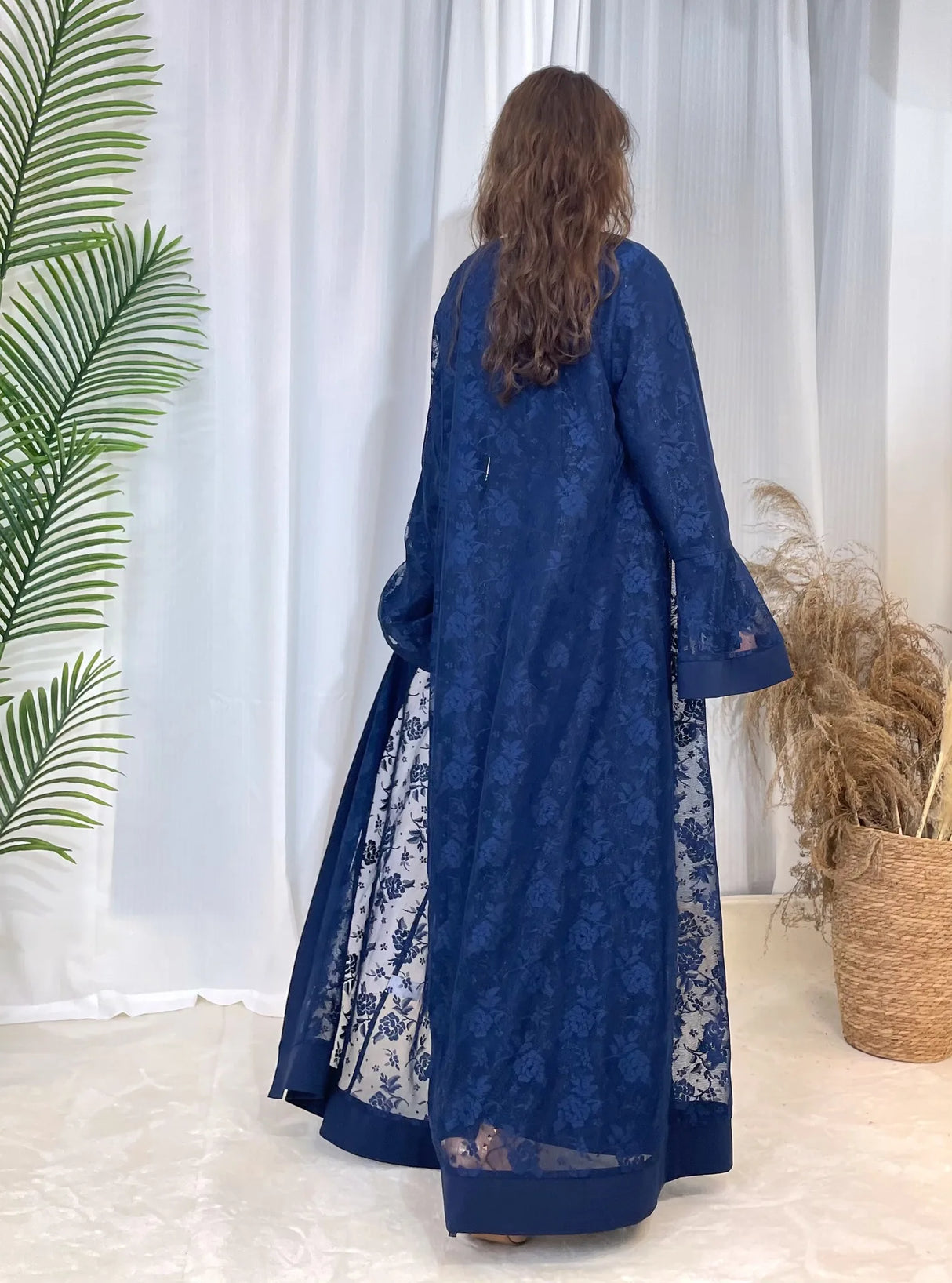 Elegant blue Dubai Moroccan Kaftan showcasing floral lace design, ideal for casual Islamic wear in all seasons.