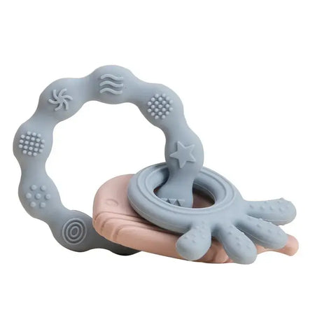 Soft silicone baby teether gloves in blue and pink, designed to relieve tooth pain for infants aged 0-6 years.