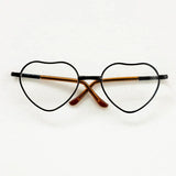 Heart-shaped baby glasses for newborn photography, colorful, unisex, perfect accessory for unique photo shoots.