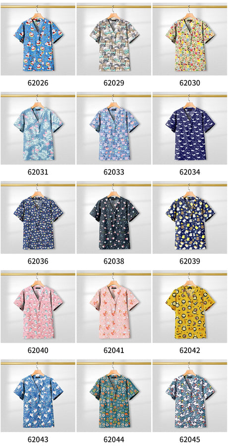 Colorful collection of printed short sleeve scrub tops displayed for healthcare professionals, featuring various designs and patterns.