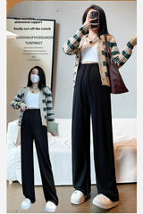 Wide-leg maternity pants modeled with a casual outfit, featuring a drawstring waist for comfort and style.