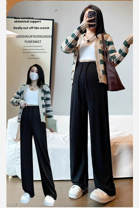 Wide-leg maternity pants modeled with a casual outfit, featuring a drawstring waist for comfort and style.