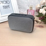 Portable outdoor Bluetooth 5.0 mini speaker with sleek design and strap, perfect for music on-the-go.
