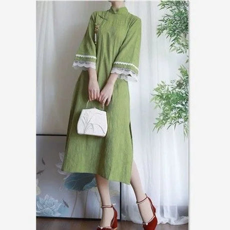 Cotton Jacquard Cheongsam dress in green with lace sleeves, paired with a stylish handbag, perfect for boys' fashion.