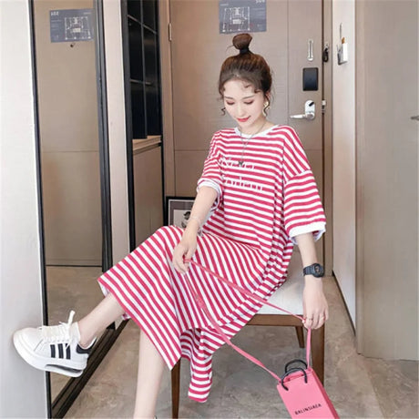 Striped maternity dress in red and white, featuring a boat neck and loose fit, perfect for summer wear.