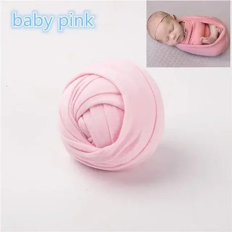 Soft baby pink photography backdrop blanket for newborns, perfect for unisex photo shoots.