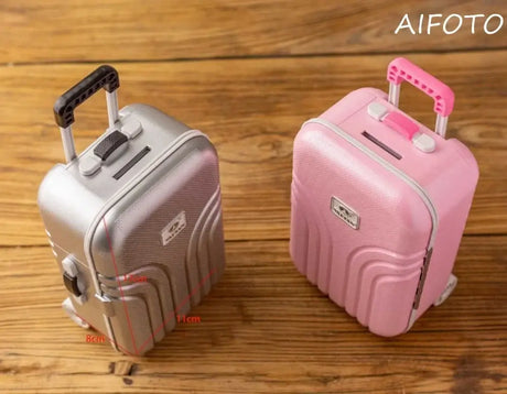 Two creative mini suitcases, one silver and one pink, showcasing their unique designs and child-friendly features.
