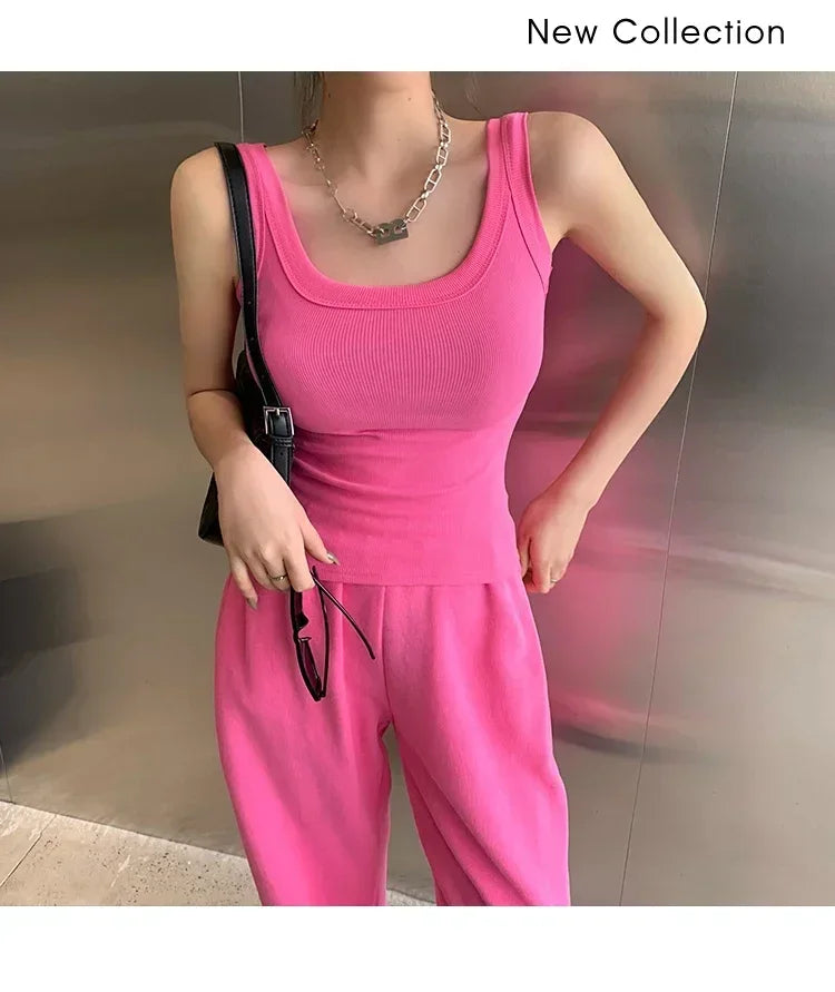 Model wearing RetroRib™ 90s vintage ribbed tank top in pink, styled with matching pants. Part of the new collection.