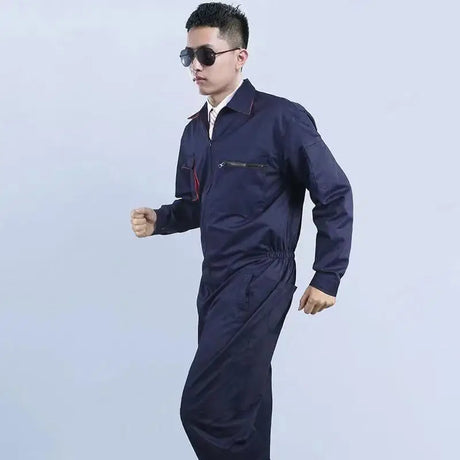 Man in mechanic welding coveralls, showcasing a durable, waterproof uniform for auto repair. Unisex design perfect for safety.