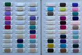 Color swatches showcasing a variety of fabric options in purple, pink, blue, and neutral tones arranged neatly.