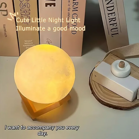 LED moon galaxy book light illuminating a cozy atmosphere, surrounded by books, perfect for night reading and decor.
